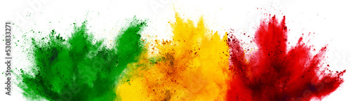 colorful ghanaian or senegalese flag green red yellow color holi paint powder explosion isolated white background. Ghana senegal africa qatar celebration soccer travel tourism concept photo