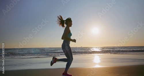 sport woman running on beach