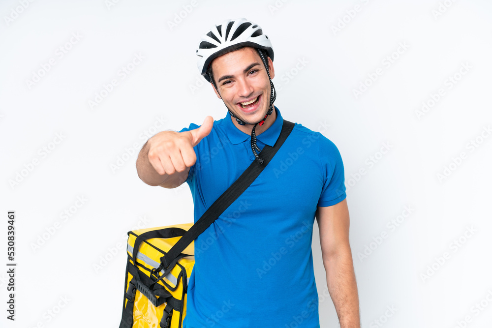 Young caucasian man with thermal backpack isolated on white background with thumbs up because something good has happened Young caucasian man with thermal backpack isolated on white background with thumbs up because something good has happened