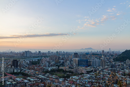 Sunset aerial view of the cityscape of Wenshan District of Taipei from Xianjiyan photo