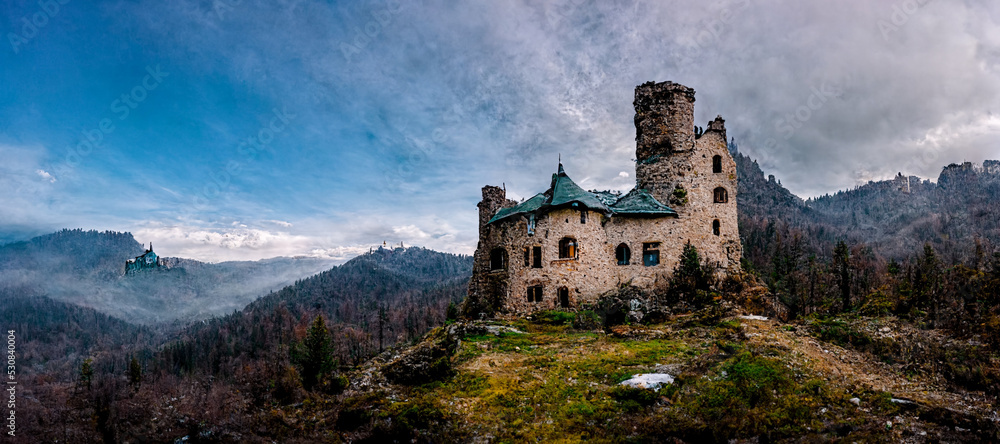 3D Illustration of a lonely abandoned castle in the mountains with dramatic sky background