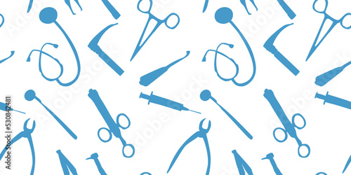 Pattern of medical instruments on a white background. Blue silhouettes of scissors, syringe, tweezers, laryngoscope, stethoscope, dental drill. Endless seamless background for medicine, Doctor's Day. photo
