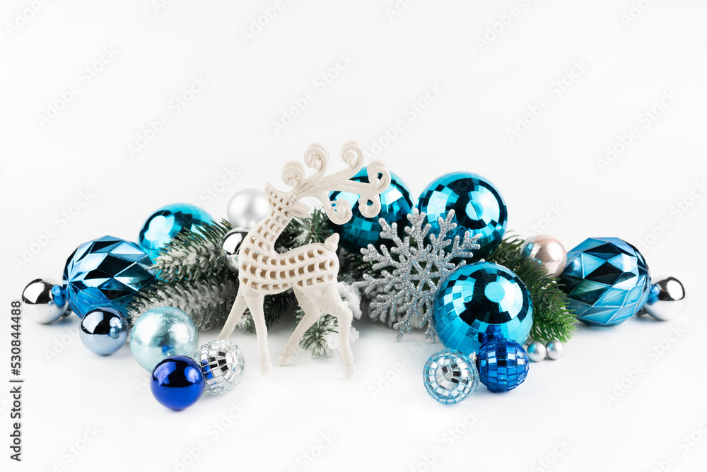 On a white background, a Christmas deer with a New Year's decor in blue tones. On a white background, a Christmas deer with a New Year's decor in blue tones.
