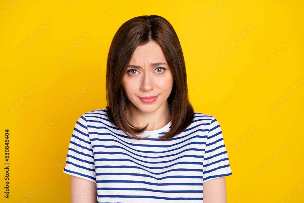 Photo of stressed gorgeous adorable woman with bob hairstyle wear striped t-shirt feel guilty excuse isolated on yellow color background Photo of stressed gorgeous adorable woman with bob hairstyle wear striped t-shirt feel guilty excuse isolated on yellow color background