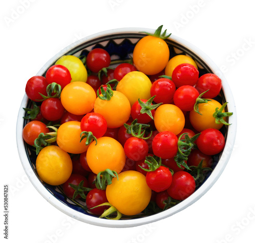 Small fresh multicolored and shiny tomatoes. Concept of freshness.