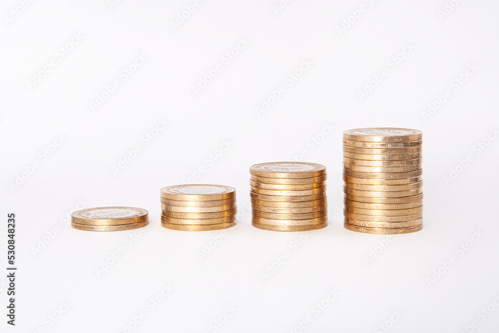 Close-up of coins stack on white background. Close-up of coins stack on white background.