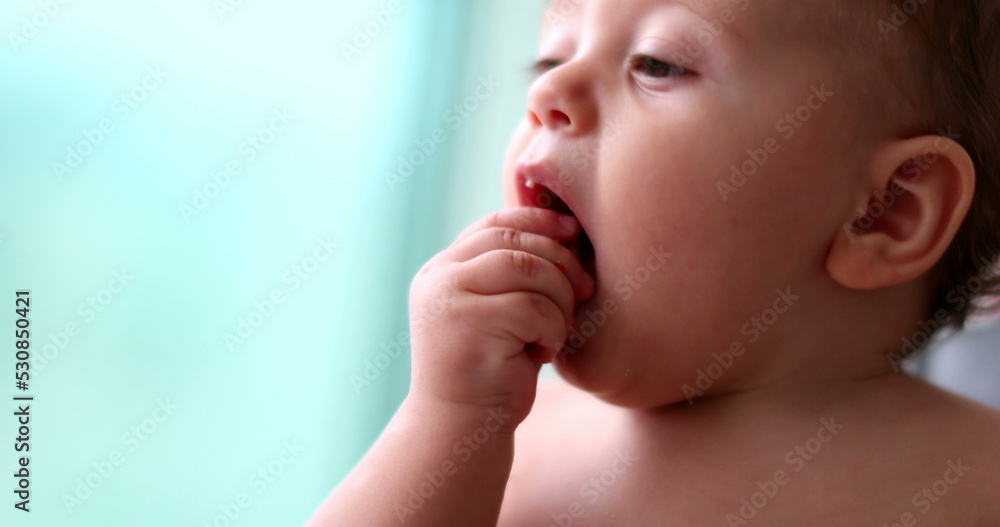 Cute baby grabbing food eating, feeding infant boy child portrait face