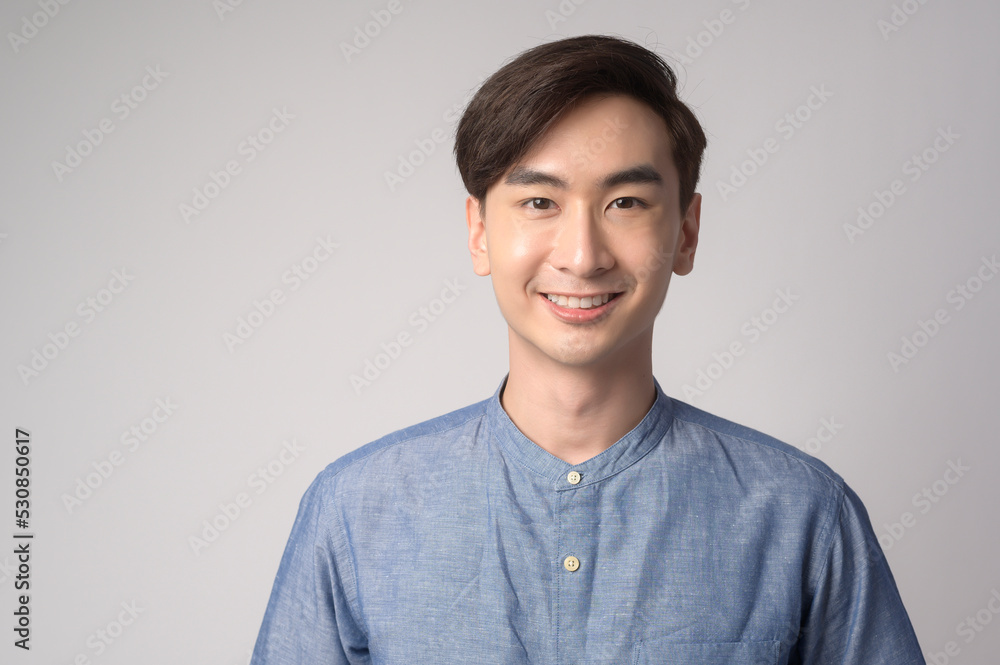 Portrait of young asian man over white background studio. Portrait of young asian man over white background studio.