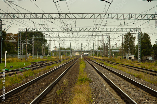 railway, in the photo straight lines of railway tracks against a gray sky