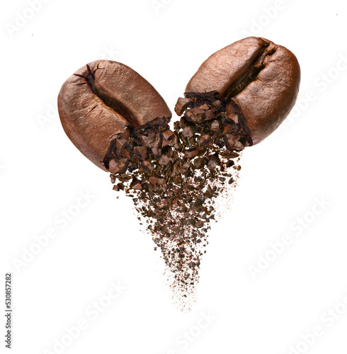 Mixed ground arabica and robusta coffee beans falling isolated on white background.