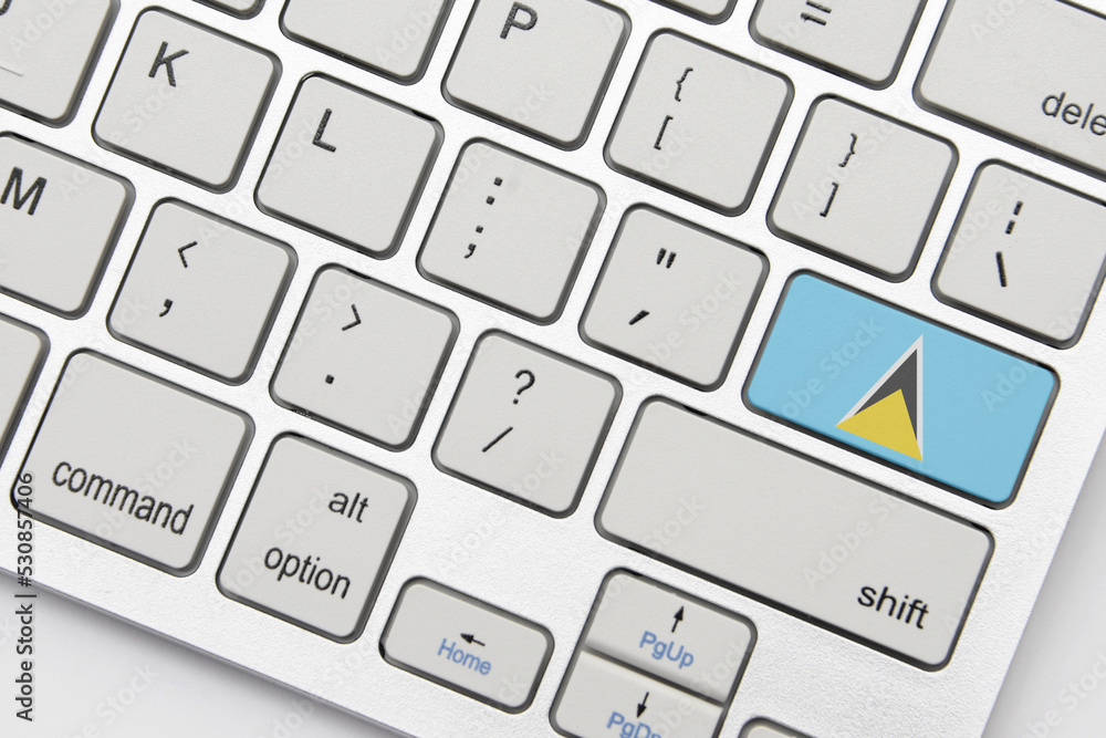 national flag of saint lucia on the keyboard on a grey background .3d illustration national flag of saint lucia on the keyboard on a grey background .3d illustration