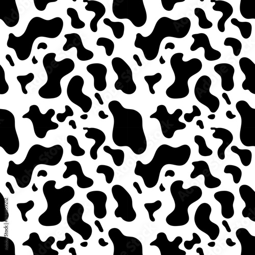 Seamless cow spots pattern.  Seamless vector animal print in black color for fabric or paper.