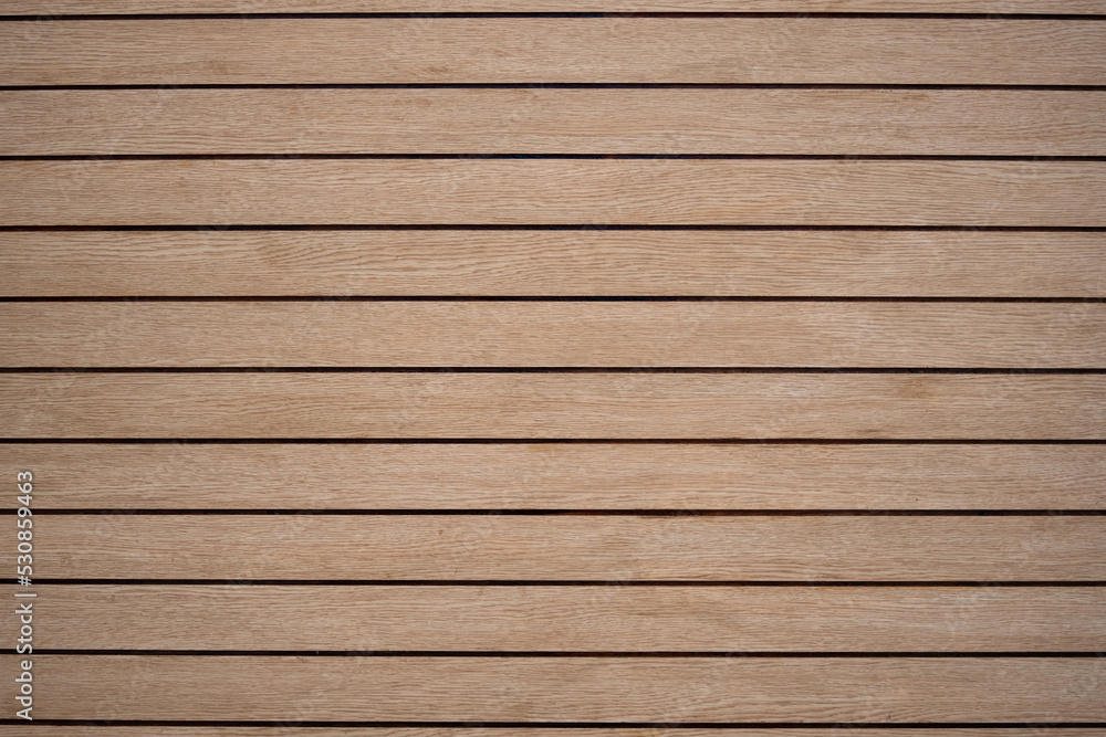 Arranged pattern brown wooden planks board background makes you feel warm and natural. Arranged pattern brown wooden planks board background makes you feel warm and natural.