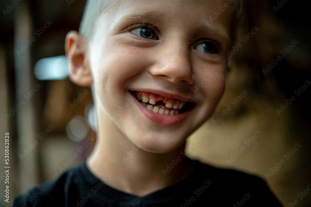 portrait of a 6-year-old boy in close-up, whose baby tooth fell out portrait of a 6-year-old boy in close-up, whose baby tooth fell out