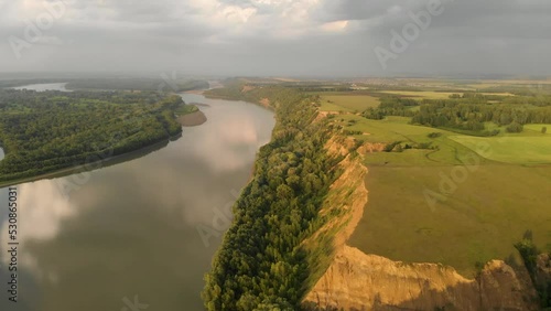 Aerial view of big siberian Ob river, river bank in beauty summer evening, 4K drone footage.