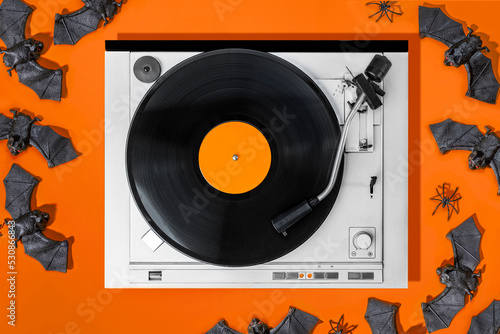 Halloween decorations, Vinyl records, party music, top view. Empty copy space for record label mockup for the design of a poster, postcard, and flyer for music events photo