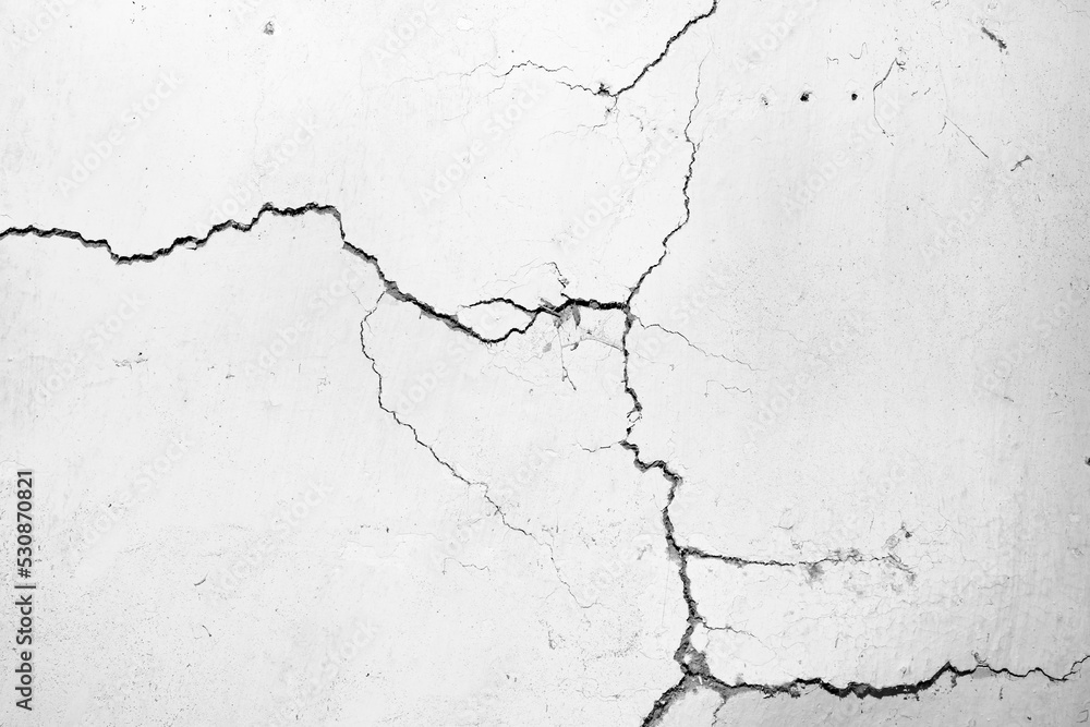 cracked concrete wall covered with gray cement surface as background cracked concrete wall covered with gray cement surface as background