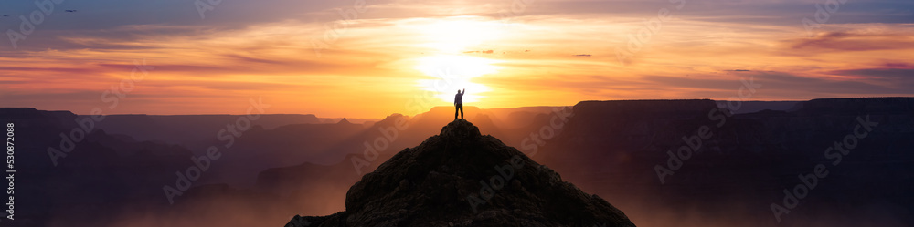 Epic Adventure Composite of Man Hiker on top of a rocky mountain. Dramatic Sunset Sky. 3d Rendering peak. Background landscape from North America. Freedom Concept.