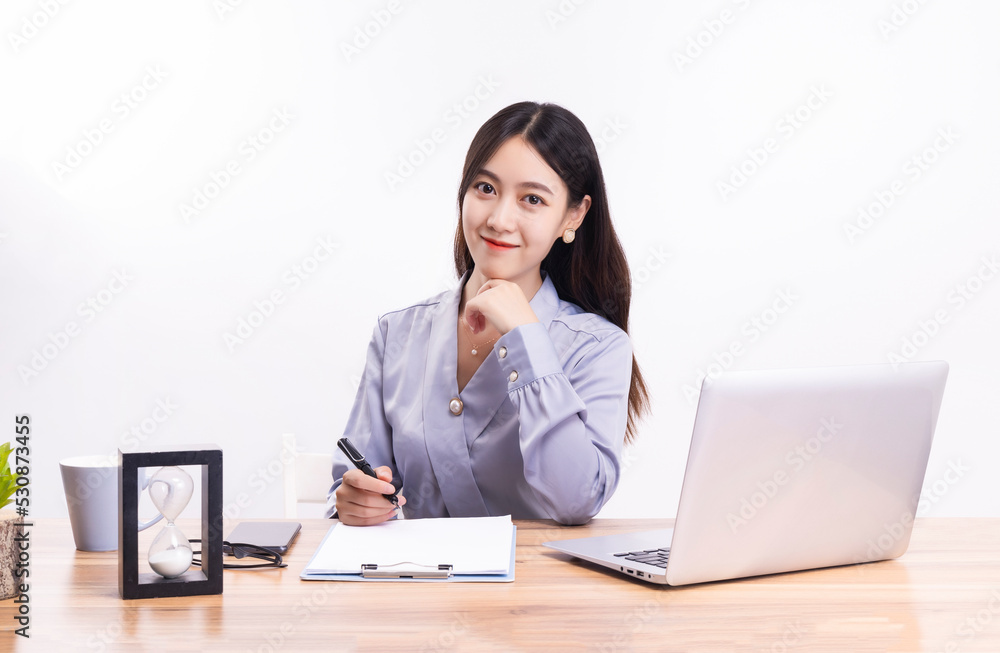Business women who sit at their desks Business women who sit at their desks