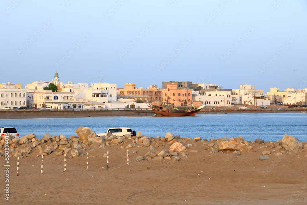 March 21 2022 - Sur, Oman: People come together at the harbor in the bay of Sur