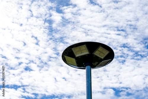 solar light blue sky background with white clouds on a clear day, Solar cell lamp, and Alternative energy from the sun.