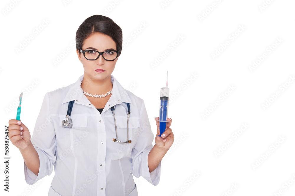 Beautiful woman doctor holding syringe, scalpel and stethoscope isolated with copy space for text Beautiful woman doctor holding syringe, scalpel and stethoscope isolated with copy space for text
