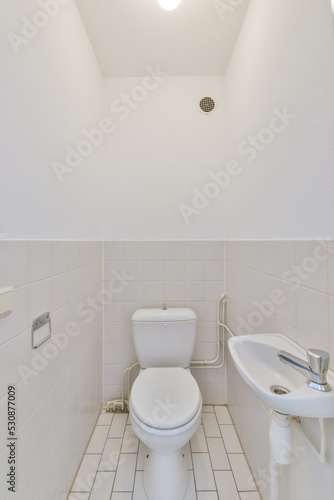 Interior of bathroom with toilet and sink