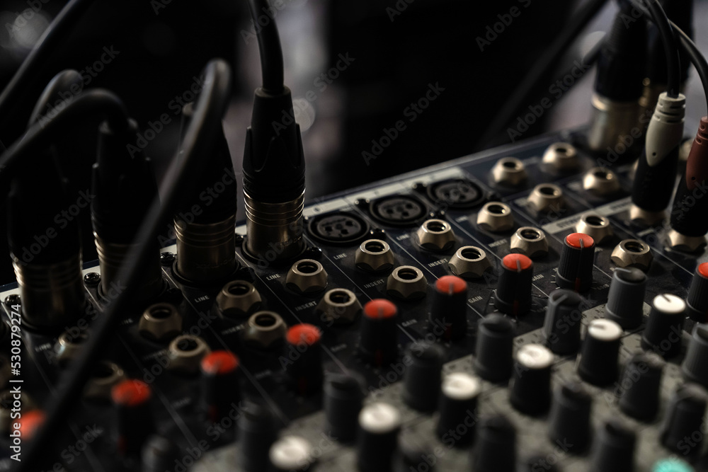 Naklejka premium Mixer control. Music engineer. Backstage controls on an audio mixer, Sound mixer. Professional audio mixing console with lights, buttons, faders and sliders. sound check for concert.