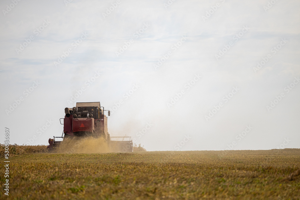 harvester rides across the field harvests harvester rides across the field harvests