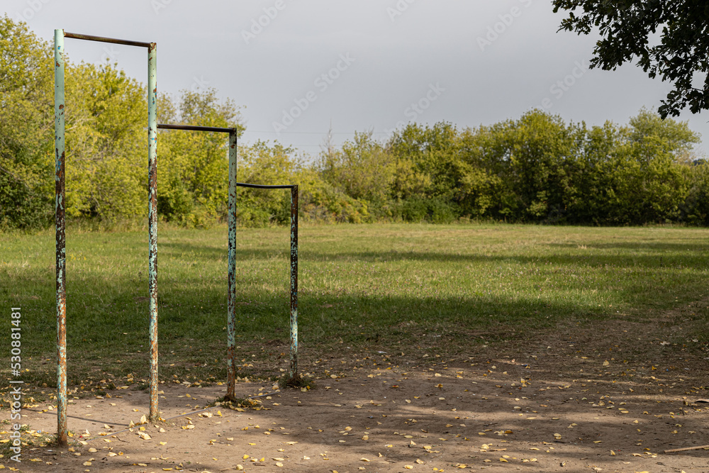old sports ground with a horizontal bar in the park old sports ground with a horizontal bar in the park
