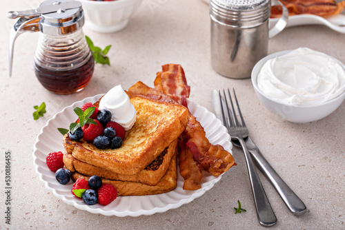 Slika na platnu Classic french toast with bacon and berries