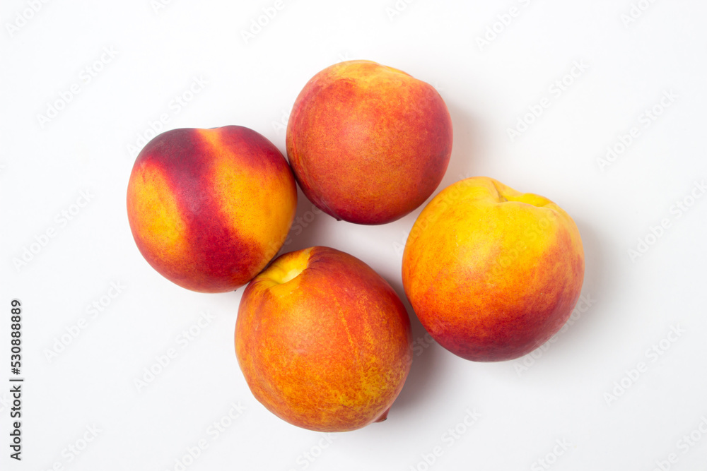 Nectarine isolated on white background. Ripe and tasty fruits Nectarine isolated on white background. Ripe and tasty fruits