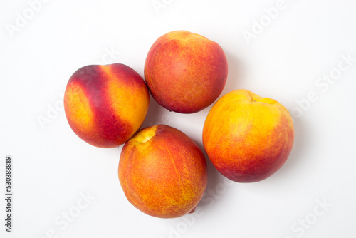 Nectarine isolated on white background. Ripe and tasty fruits