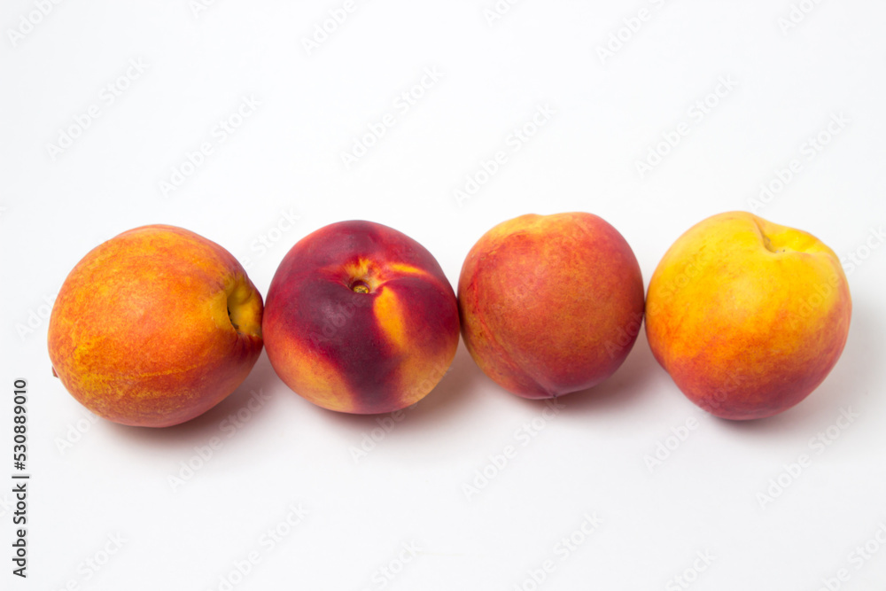 Nectarine isolated on white background. Ripe and tasty fruits Nectarine isolated on white background. Ripe and tasty fruits