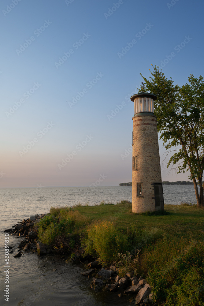 Small lighthouse on lake shore