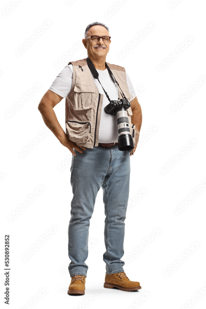 Full length portrait of a mature male photographer with a camera on a strap around neck Full length portrait of a mature male photographer with a camera on a strap around neck