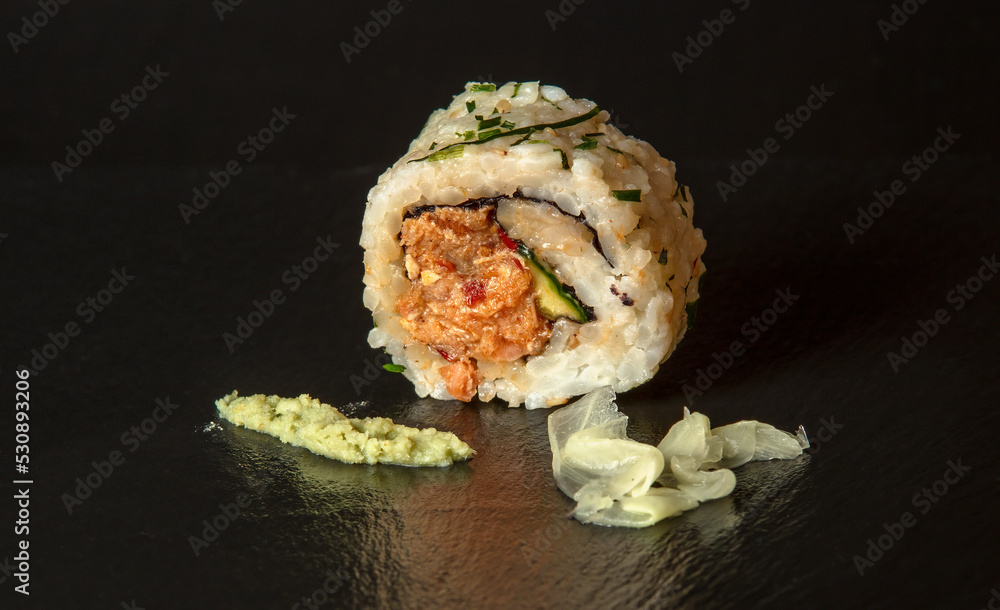 Spicy Salmon rsushi roll with wasabi and pickled ginger Spicy Salmon rsushi roll with wasabi and pickled ginger