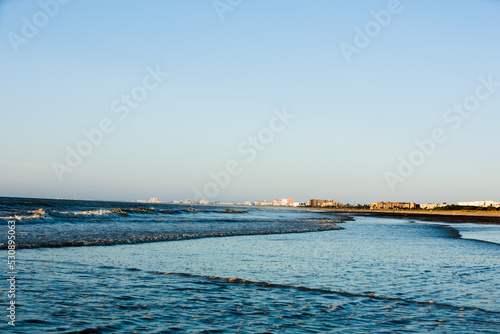 Rolling waves during golden hour at the beach