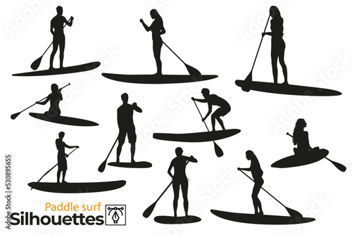 Isolated silhouettes of paddle surfers in the sea. © AlexInkfusion