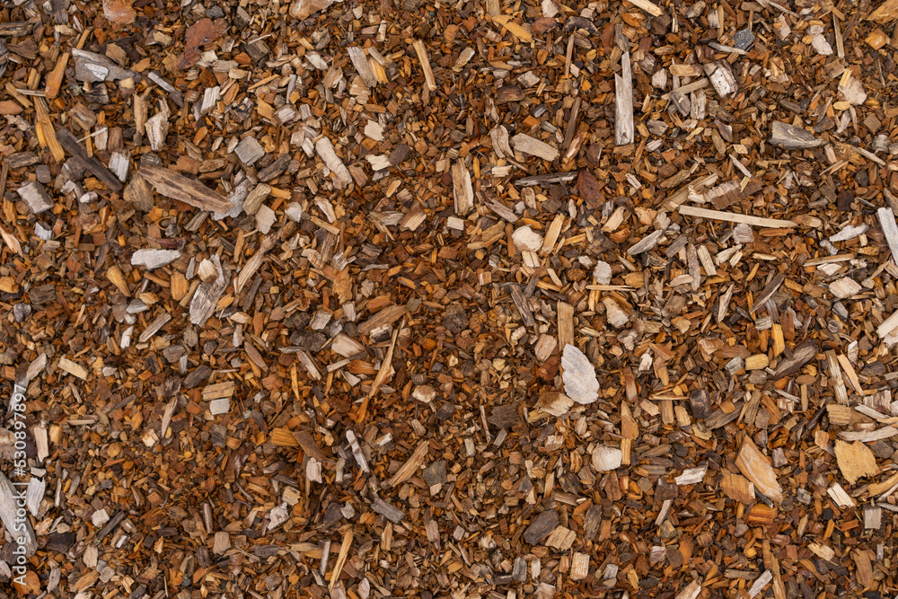 Mulch background. A pile of wood chips to be used as landscaping mulch. Mulch background. A pile of wood chips to be used as landscaping mulch.