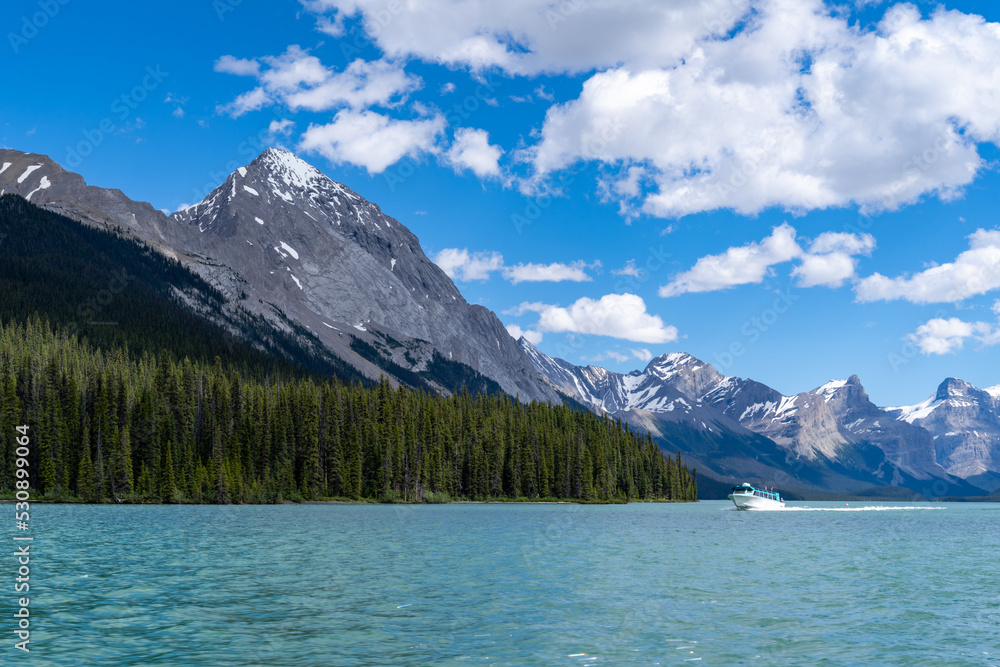 Boat on Maligne Lake, home of the famous Spirit Island, in Jasper National Park