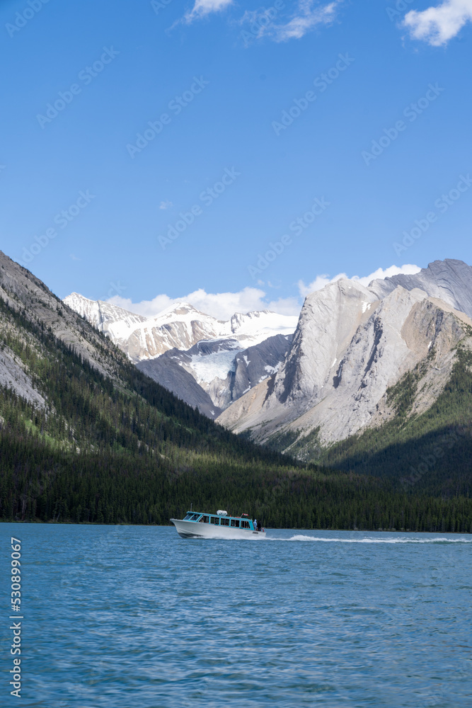 Boat on Maligne Lake, home of the famous Spirit Island, in Jasper National Park