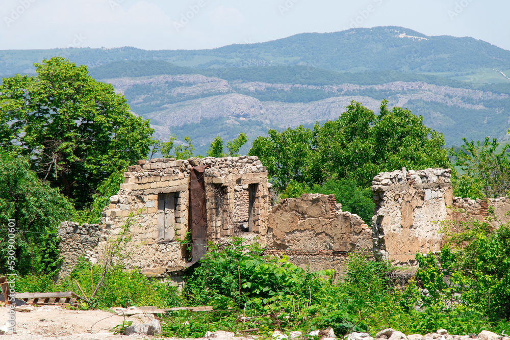 Fototapeta premium Destroyed houses during Karabakh war in Shusha city of Azerbaijan. Armenian terror in Nagorno Karabakh