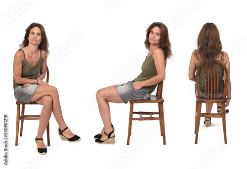 front,side and back view of a woman with denim skirt and spadrille sitting on chair on white background © curto