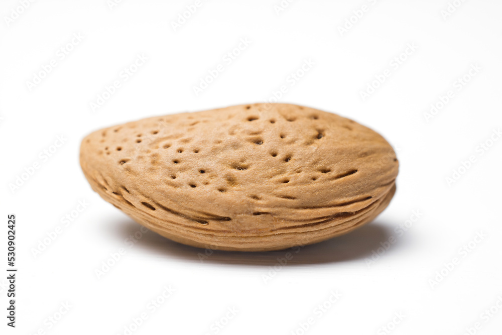 Obraz premium almonds in the peel isolated on a white
