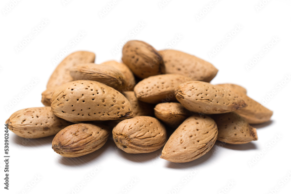 almonds in the peel isolated on a white almonds in the peel isolated on a white