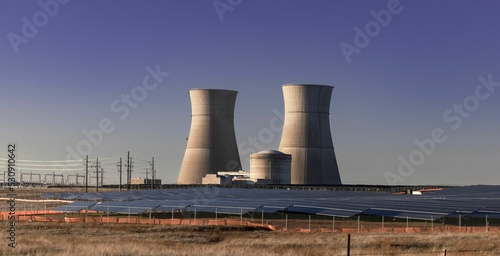 Nuclear power plants and solar panels in California against a blue sky