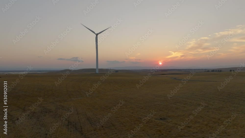 Wind Turbine at Sunset with Road in California - Sweep Left to Right Wind Turbine at Sunset with Road in California - Sweep Left to Right