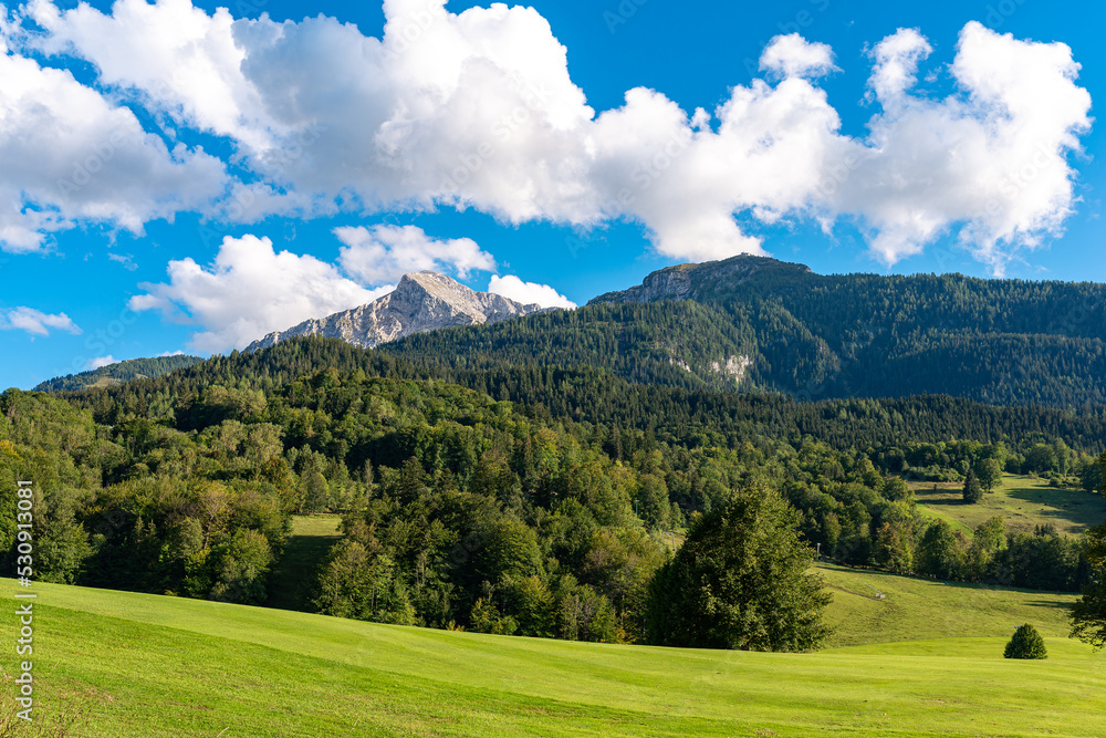 Golf course at the foot of the Göll massiv with the peak of Hoher Göll, 2522m high, and the Kehlstein with the famous Egles Nest, the house on top of the mountain Kehlstein in the Berchtesgaden Alps