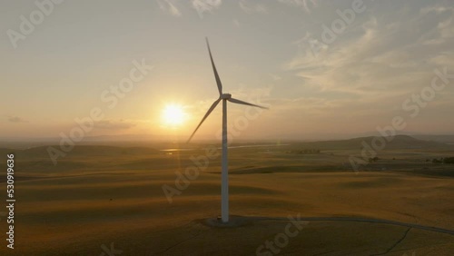 Solo Wind Turbine at Sunset with Flare - Orbit Left to Right